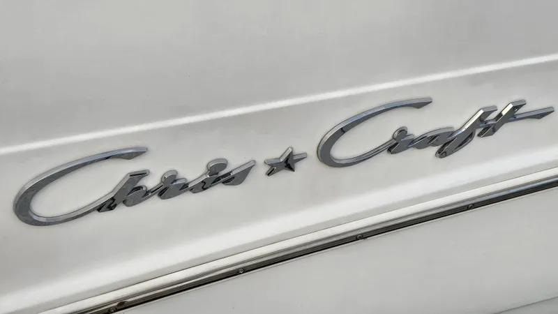 Slide: The Image of Chris-Craft 328 Express Cruiser 2000 logo on boat exterior. - 37