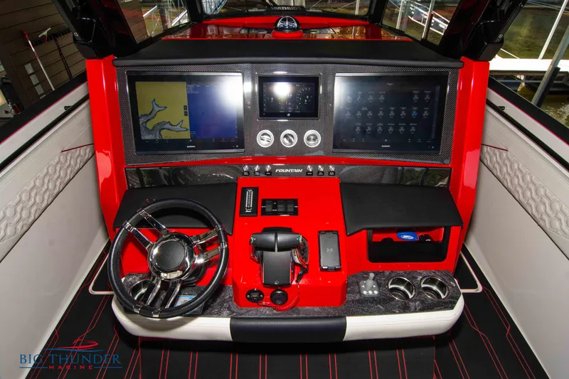 Slide: The Image of 2024 Fountain 38 SCX boat dashboard with advanced navigation and control systems. - 35