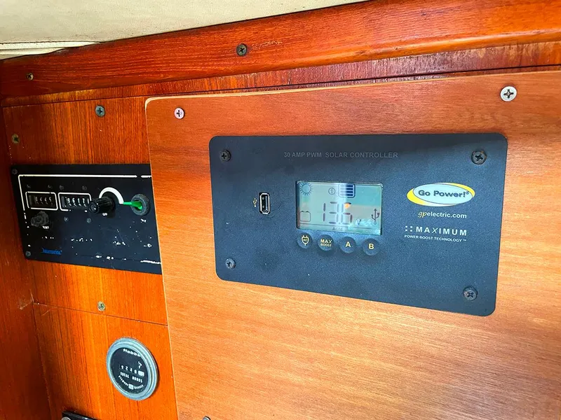 Slide: The Image of Control panel on a 1990 Ericson 38-200 sailboat with solar charge controller. - 18