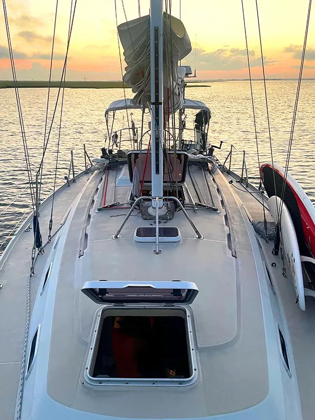 Slide: The Image of Sailboat Ericson 38-200, 1990 model, on calm water at sunset. - 3
