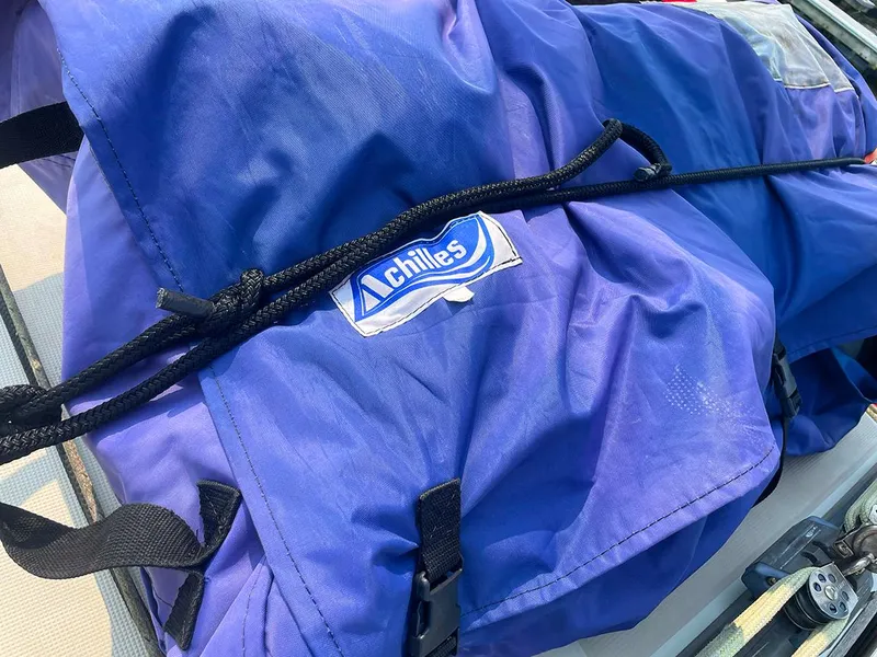 Slide: The Image of Blue sail cover with "Achilles" logo on Ericson 38-200 sailboat, 1990 model. - 8