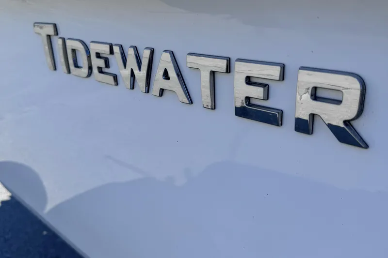 Slide: The Image of 2025 Tidewater 210 CC Adventure boat logo close-up. - 10