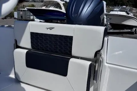 Slide: The Image of 2025 Tidewater 210 CC Adventure boat seat with stylish design and Yamaha outboard motor. - 11