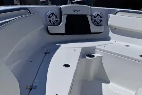 Slide: The Image of 2025 Tidewater 210 CC Adventure boat interior with seating and speakers. - 12