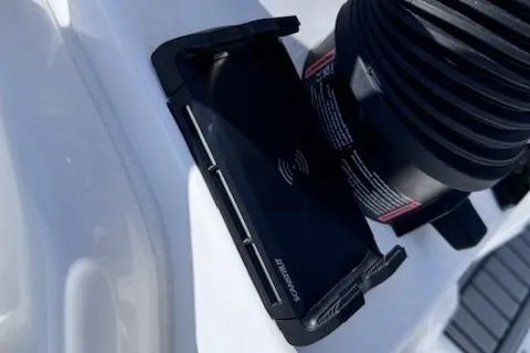 Slide: The Image of Close-up of a 2025 Tidewater 210 CC Adventure boat's phone holder. - 4