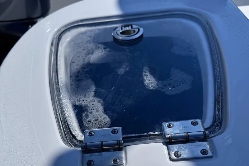 Slide: The Image of Tidewater 210 CC Adventure 2025 livewell with water and bubbles. - 8