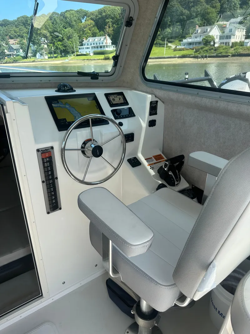 Slide: The Image of 2022 Parker 2520 XLD Sport Cabin interior with steering wheel and navigation system. - 4