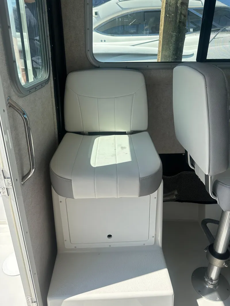 Slide: The Image of 2022 Parker 2520 XLD Sport Cabin interior seating with white upholstery. - 8
