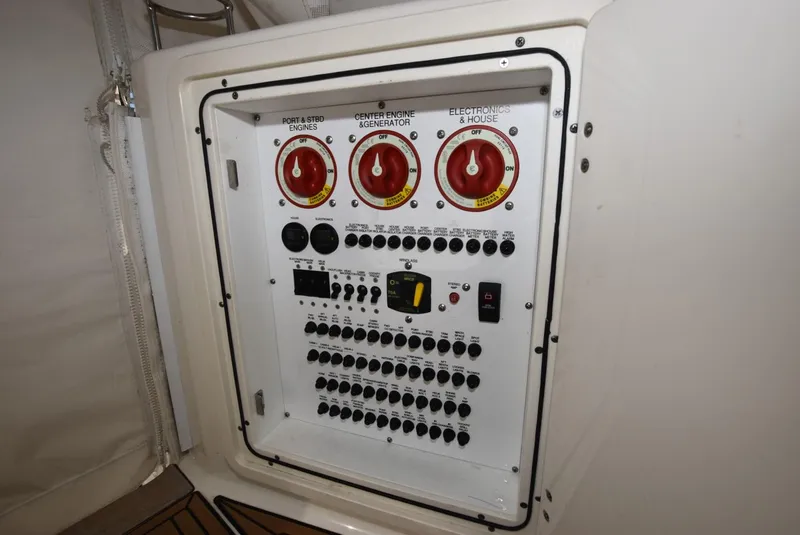 Slide: The Image of Electrical control panel on 2022 Pursuit OS 355 Offshore boat. - 24