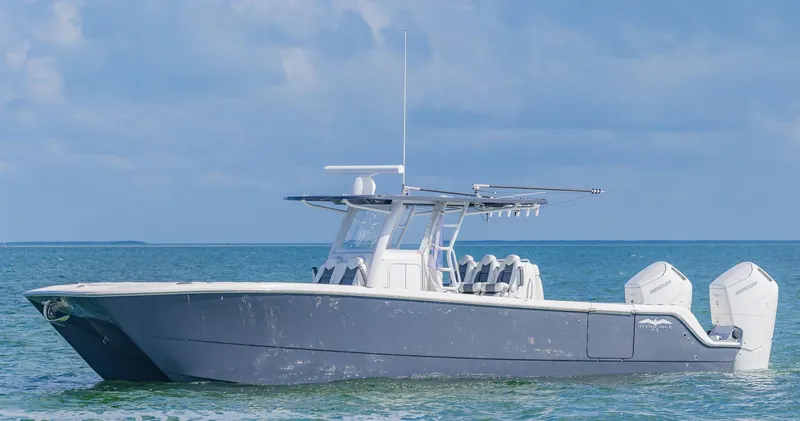 Slide: The Image of 2023 Invincible 35 Catamaran on calm ocean waters. - 0