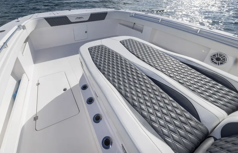 Slide: The Image of Luxurious seating on 2023 Invincible 35 Catamaran, featuring diamond-stitched upholstery and sleek design. - 10