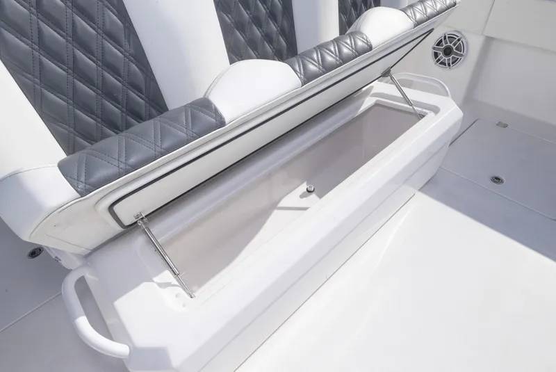 Slide: The Image of 2023 Invincible 35 Catamaran storage compartment with cushioned seating and sleek design. - 25