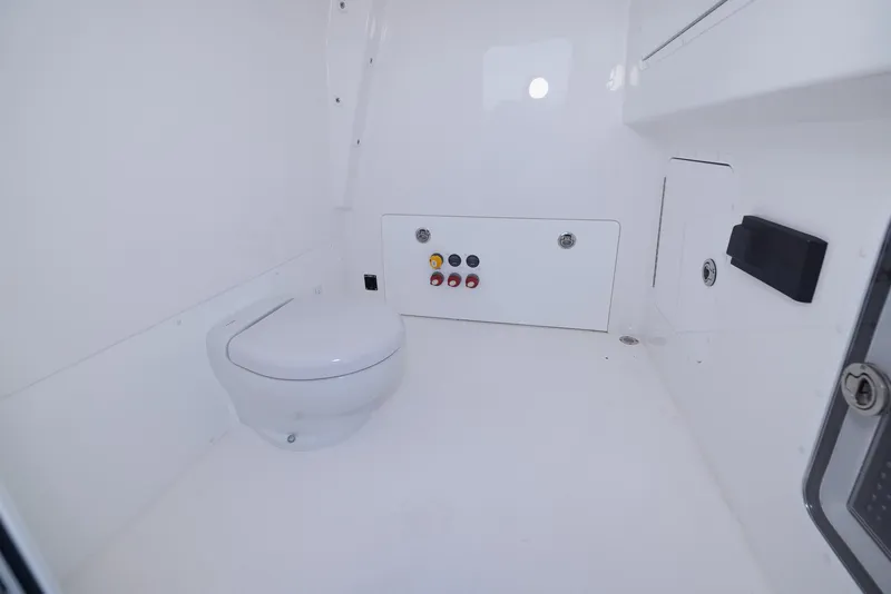 Slide: The Image of 2023 Invincible 35 Catamaran interior bathroom with modern white fixtures. - 26