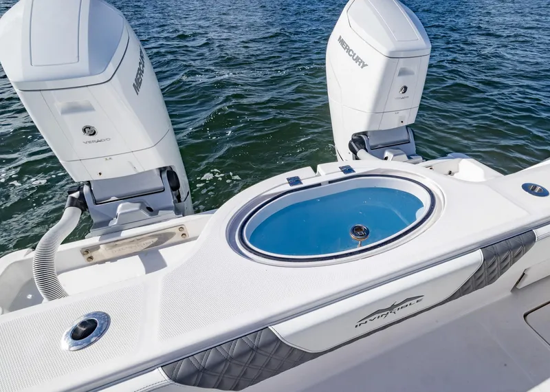 Slide: The Image of 2023 Invincible 35 Catamaran with dual Mercury engines on open water. - 30