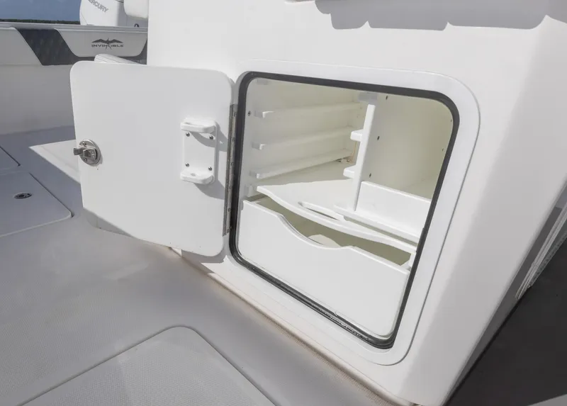 Slide: The Image of Open storage compartment on 2023 Invincible 35 Catamaran boat. - 31