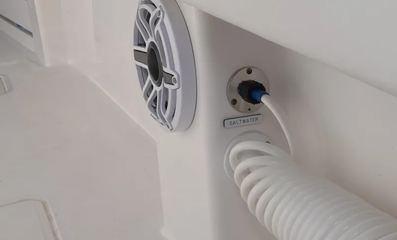 Slide: The Image of 2023 Invincible 35 Catamaran speaker and saltwater hose connection detail. - 32