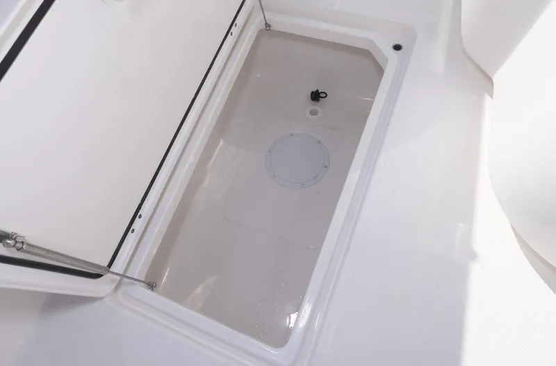 Slide: The Image of Open storage compartment on 2023 Invincible 35 Catamaran boat. - 33