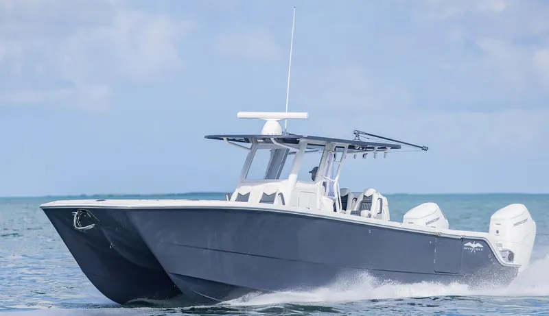 Slide: The Image of 2023 Invincible 35 Catamaran cruising on open water. - 43