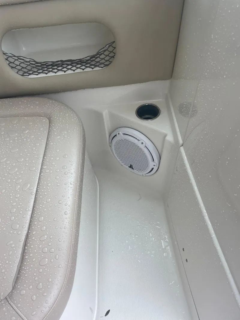 Slide: The Image of Interior of 2019 Sailfish 325 Dual Console boat with speaker and seat detail. - 21
