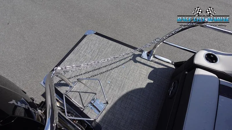 Slide: The Image of 2025 Barletta X23U boat deck with chain railing and Race City Marine logo. - 10