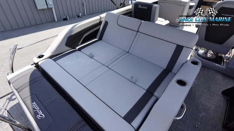 Slide: The Image of 2025 Barletta X23U boat interior with spacious seating and modern design. - 12