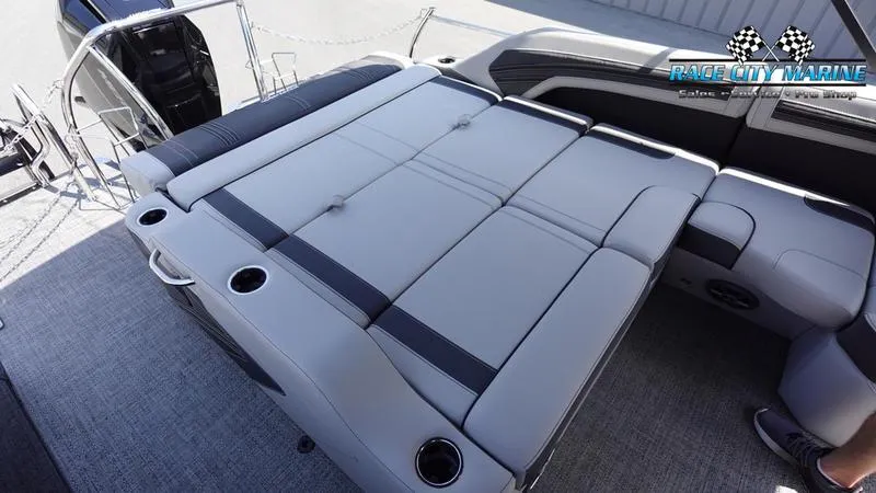 Slide: The Image of 2025 Barletta X23U boat with spacious seating and cup holders on deck. - 13