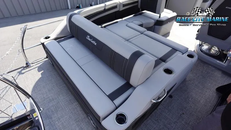 Slide: The Image of 2025 Barletta X23U boat with spacious gray seating and cup holders. - 15