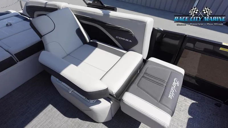 Slide: The Image of 2025 Barletta X23U boat interior with adjustable seating, Race City Marine branding. - 16