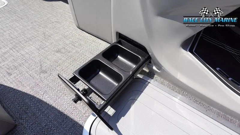 Slide: The Image of 2025 Barletta X23U boat with built-in cup holders and Race City Marine logo. - 18