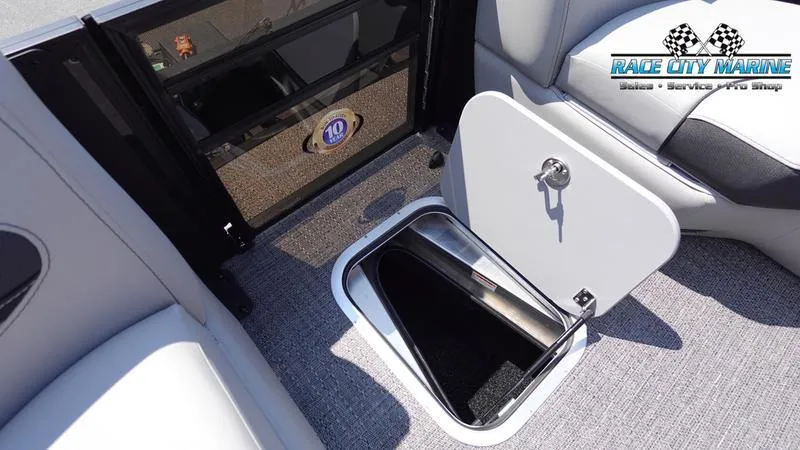 Slide: The Image of 2025 Barletta X23U boat interior with open storage compartment. - 21