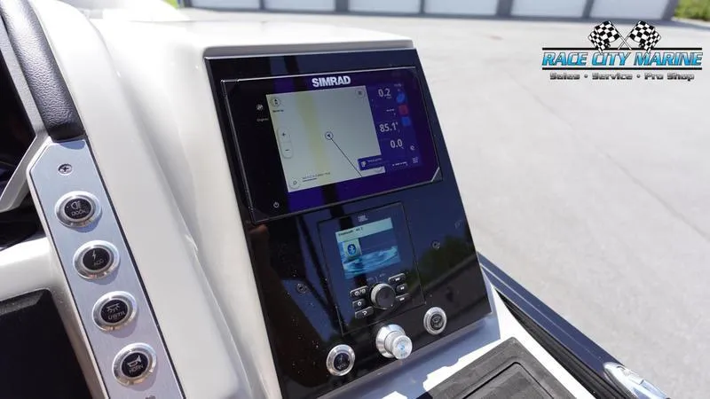Slide: The Image of Simrad navigation system on 2025 Barletta X23U boat dashboard. - 25