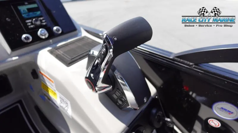 Slide: The Image of Close-up of 2025 Barletta X23U boat throttle control at Race City Marine. - 26