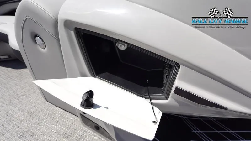 Slide: The Image of Barletta X23U 2025 boat storage compartment with open hatch, Race City Marine logo. - 32