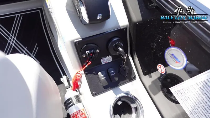 Slide: The Image of Control panel of 2025 Barletta X23U boat with safety features and branding. - 38