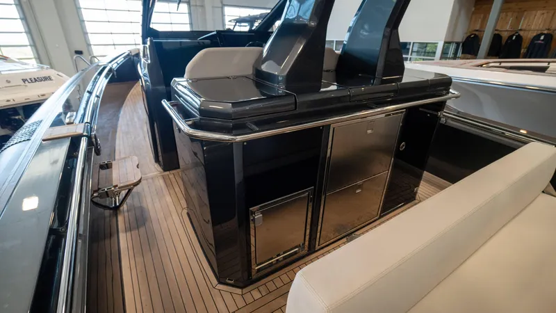Slide: The Image of 2025 Pirelli TecnoRib 42 OB luxury boat interior with sleek design and modern amenities. - 10