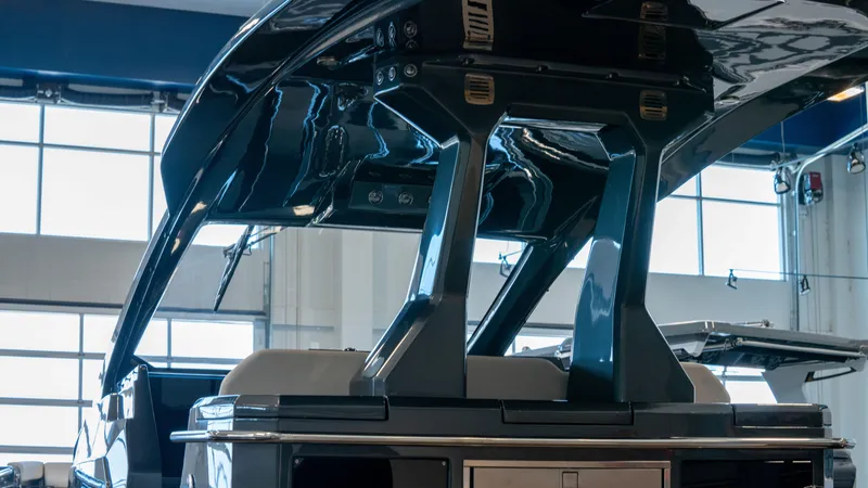 Slide: The Image of 2025 Pirelli TecnoRib 42 OB boat interior with sleek design in a showroom. - 11