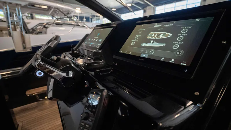 Slide: The Image of Pirelli TecnoRib 42 OB 2025 dashboard with advanced navigation screens and controls. - 13