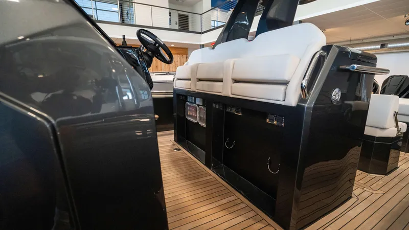 Slide: The Image of 2025 Pirelli TecnoRib 42 OB luxury boat interior with sleek design and modern seating. - 14