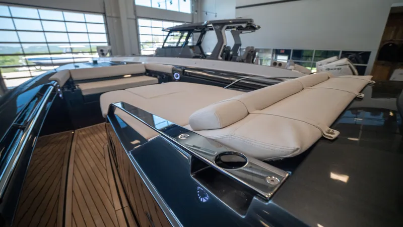 Slide: The Image of 2025 Pirelli TecnoRib 42 OB luxury boat interior with sleek design and comfortable seating. - 15