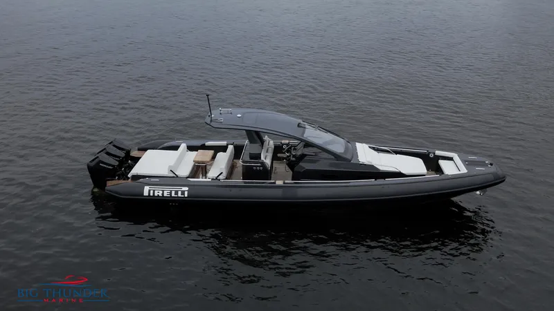 Slide: The Image of 2025 Pirelli TecnoRib 42 OB luxury boat on calm water. - 2