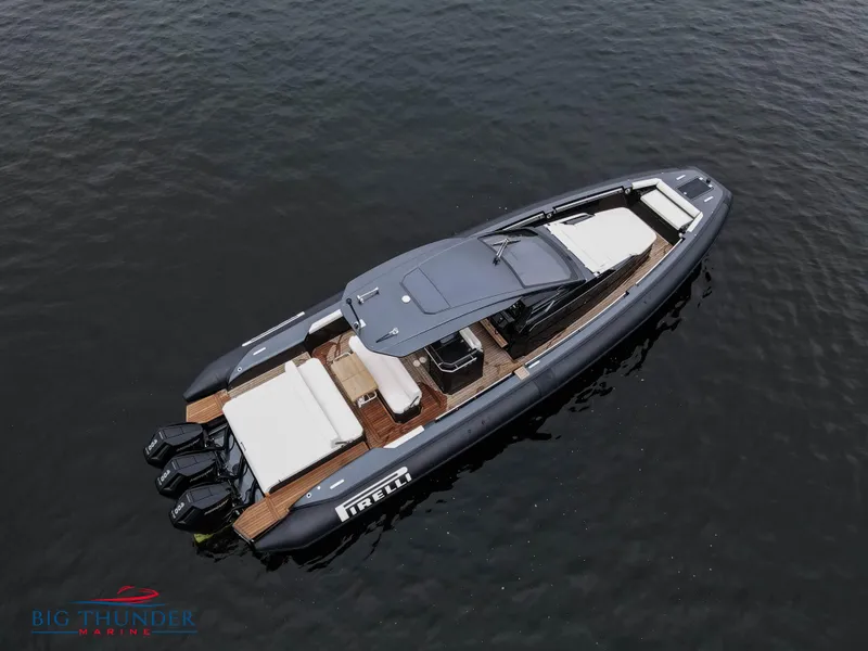 Slide: The Image of 2025 Pirelli TecnoRib 42 OB luxury boat on calm water. - 5