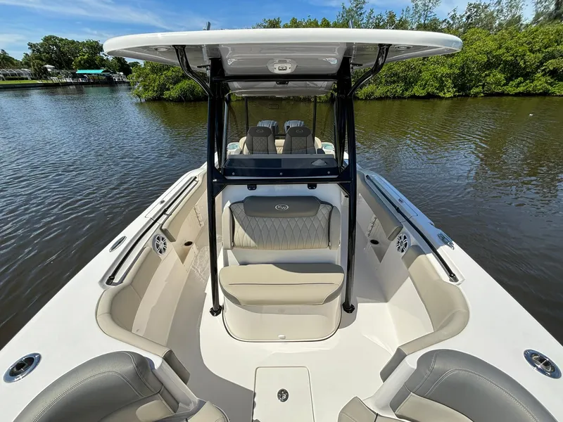 Slide: The Image of 2025 Key West 263 FS boat interior with seating, on calm water. - 15