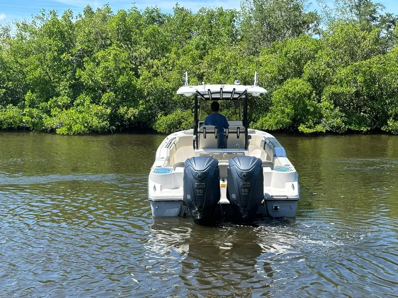 Slide: The Image of 2025 Key West 263 FS boat cruising on a calm river. - 5