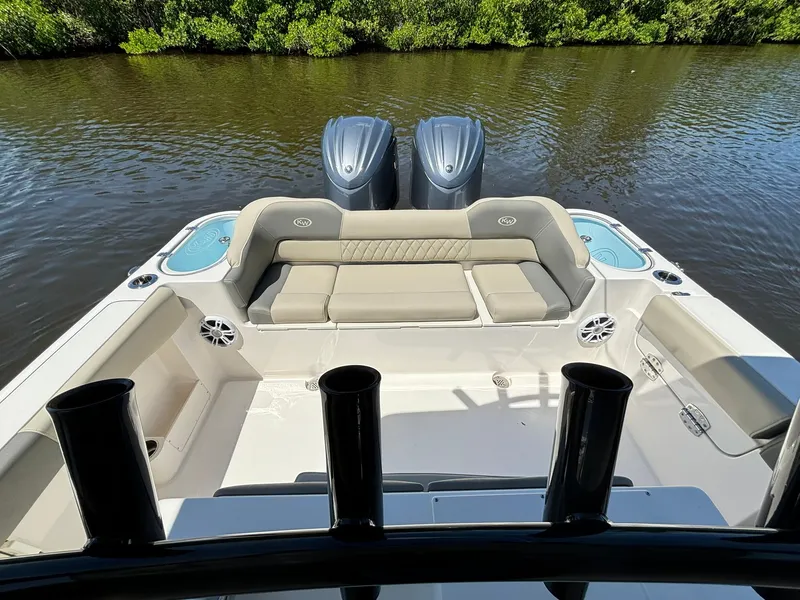 Slide: The Image of 2025 Key West 263 FS boat with dual engines and spacious seating on a calm river. - 6