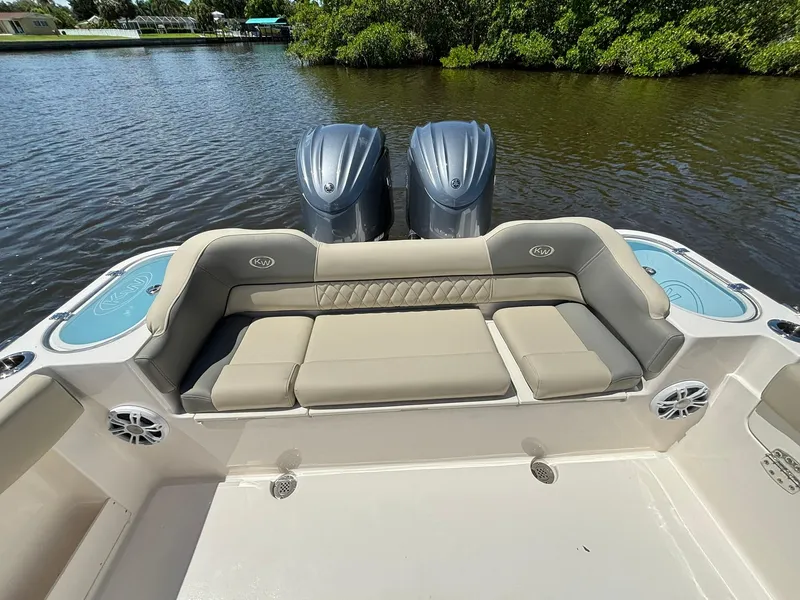 Slide: The Image of 2025 Key West 263 FS boat with dual engines and comfortable seating on a calm river. - 7