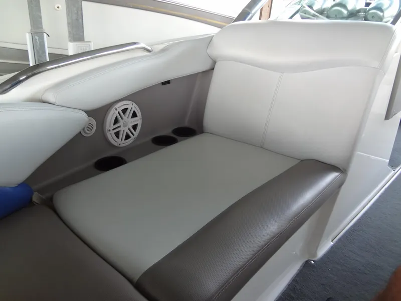 Slide: The Image of 2004 MasterCraft X-Star boat interior seating with speaker and cup holders. - 16