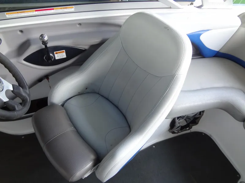 Slide: The Image of 2004 MasterCraft X-Star boat interior with gray and blue seating. - 18