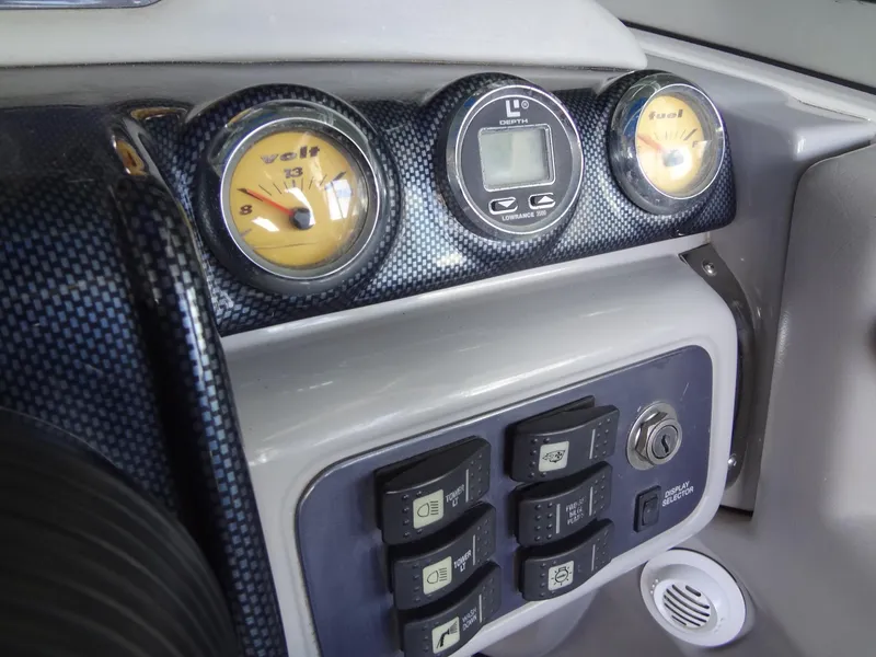 Slide: The Image of Dashboard of a 2004 MasterCraft X-Star boat with gauges and control panel. - 23