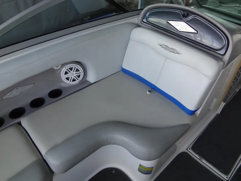 Slide: The Image of 2004 MasterCraft X-Star boat interior with gray seating and speaker. - 25
