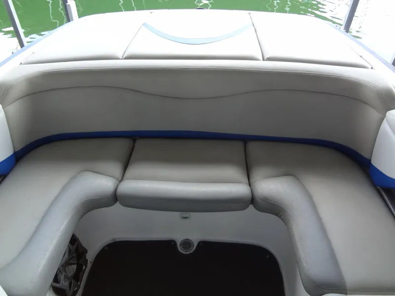 Slide: The Image of 2004 MasterCraft X-Star boat interior with gray seating and blue accents. - 26
